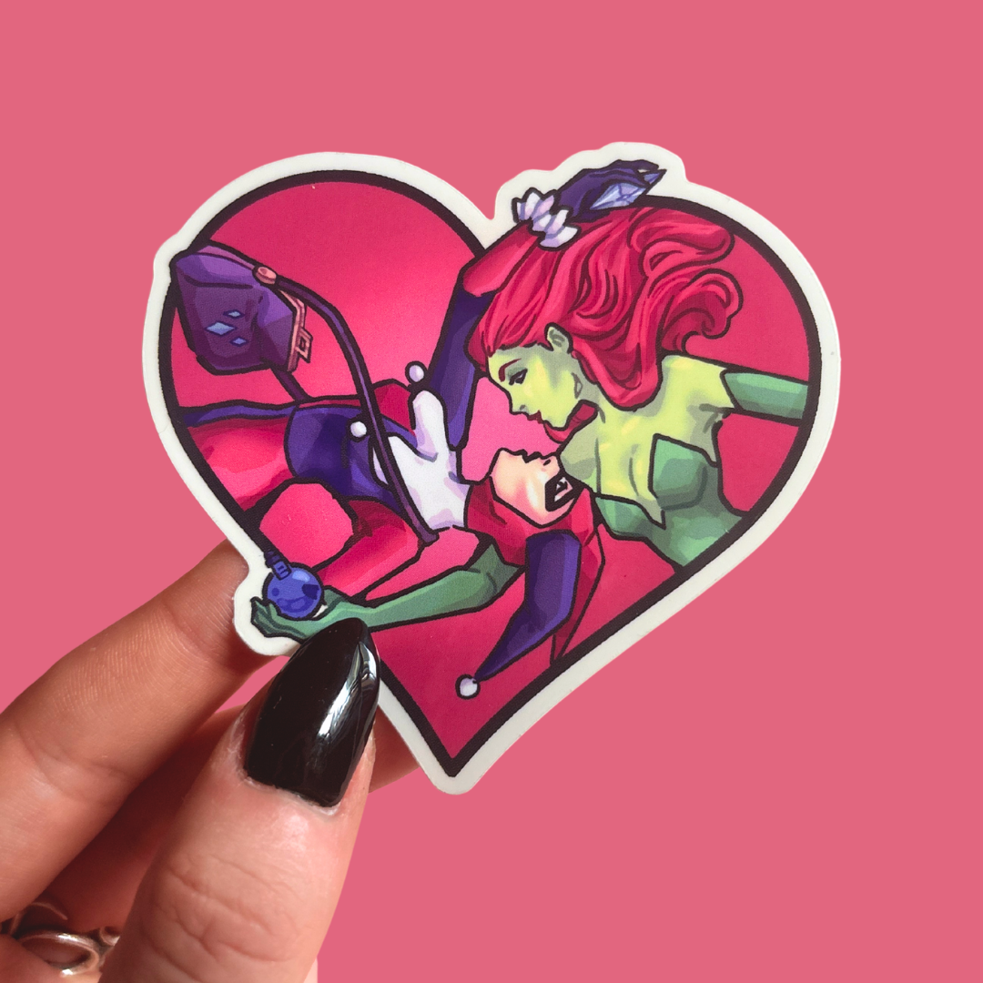 Heart-shaped sticker with colorful illustration of a character and purple creature on a pink background