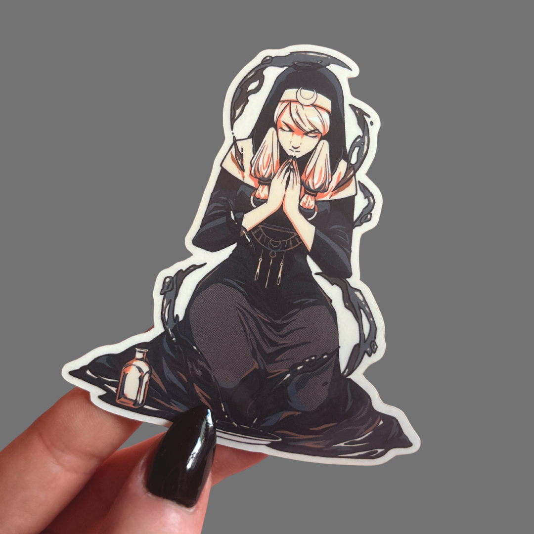 Sticker of an anime-style character with white hair and black outfit held by a hand on a gray background