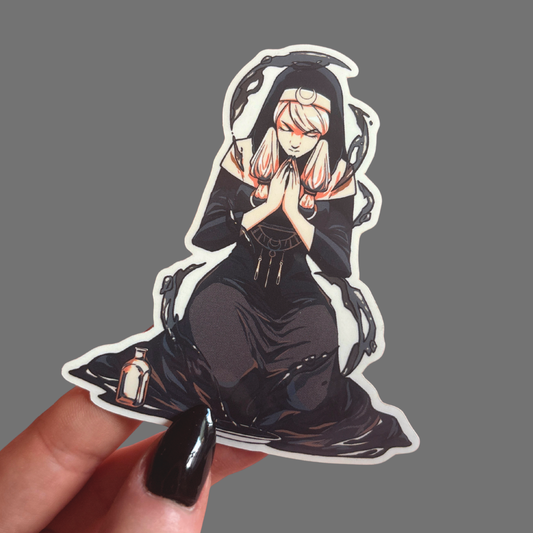 Sticker of an anime-style character with white hair and black outfit held by a hand on a gray background