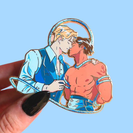 Enamel pin of two male characters embracing against a blue background with ropes