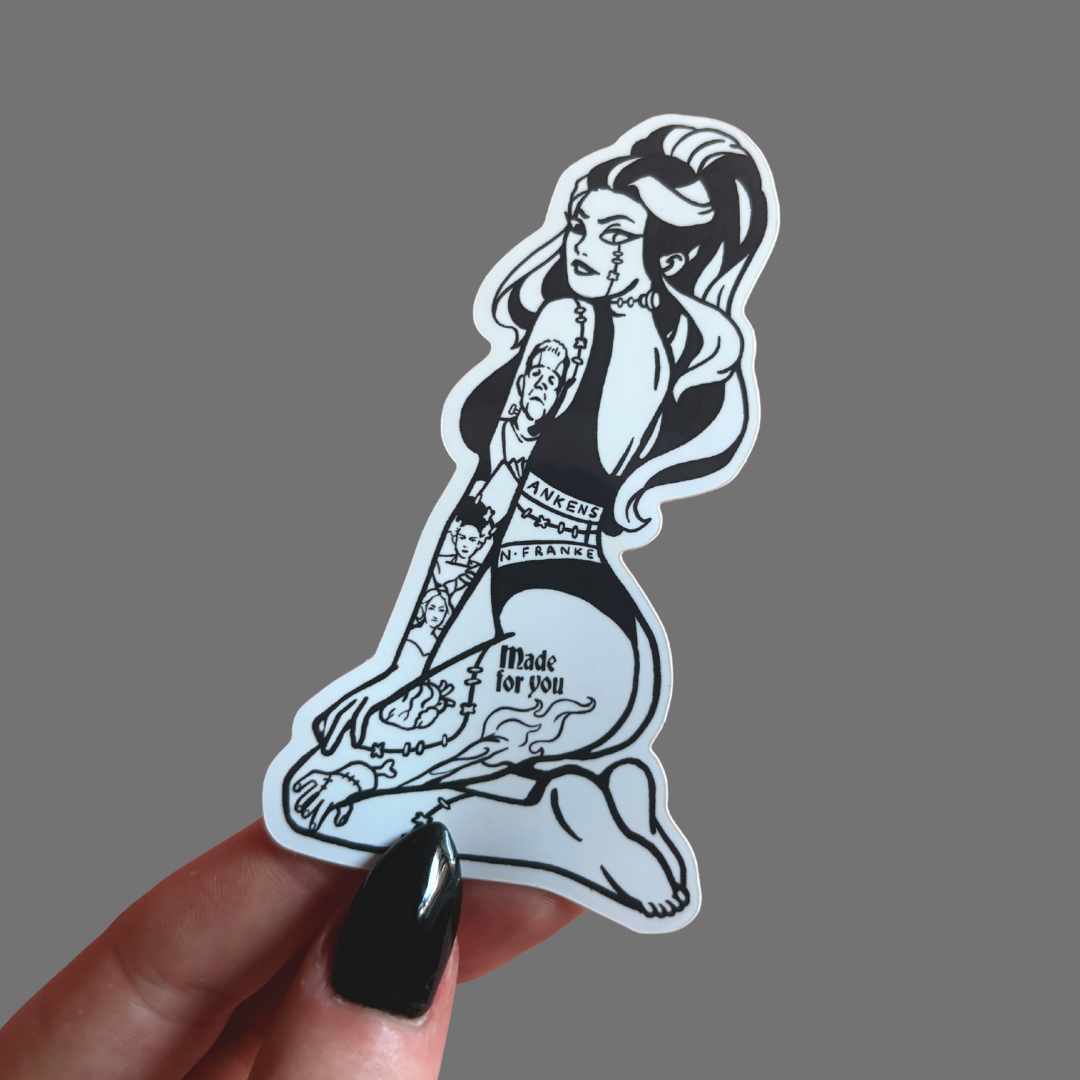 Sticker of a tattoo-style design of a woman with long hair and tattoos on a gray background.