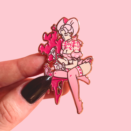 Pin with cartoon character on a pink background pouring a love potion