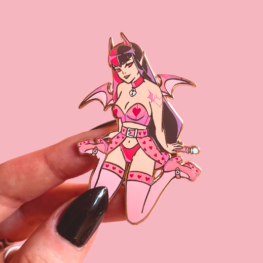 Pin with a stylized character in a pink outfit against a pink background