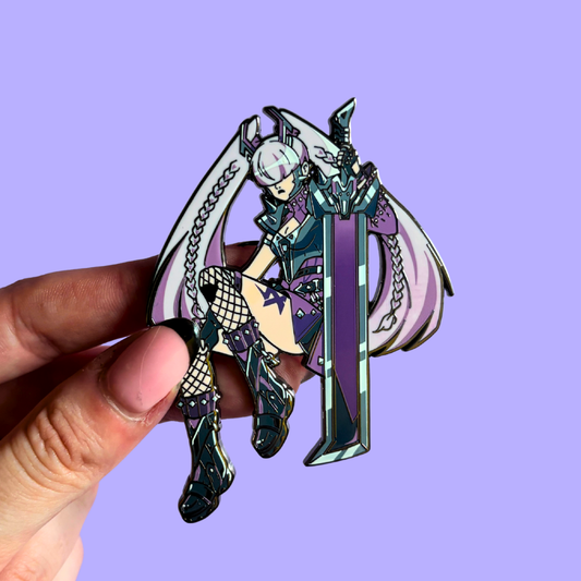 Hand holding a stylized punk character pin with a large weapon against a purple background