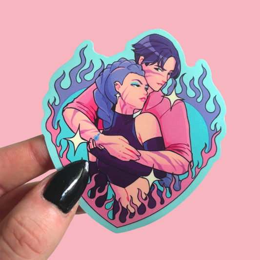 Sticker of two people embracing with flames around, held against a pink background