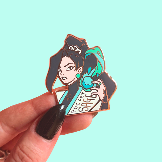 Pin with an illustration of a character with text saying 'Pocket Sage' against a light blue background.