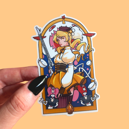 Sticker of an animated character held by a hand on a beige background